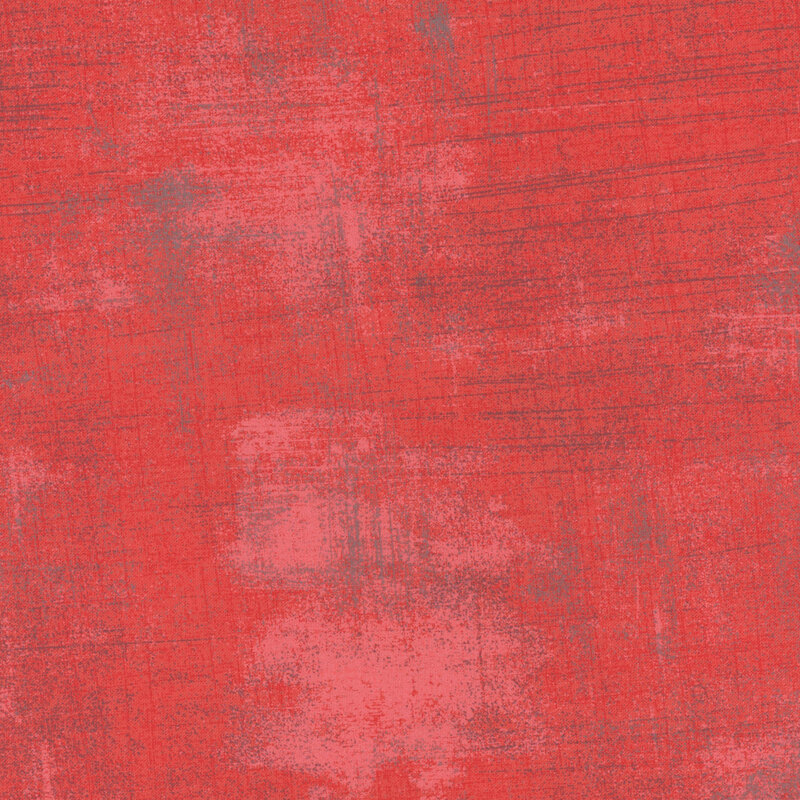 Solid red fabric with subtle texture and slight variations in shade.