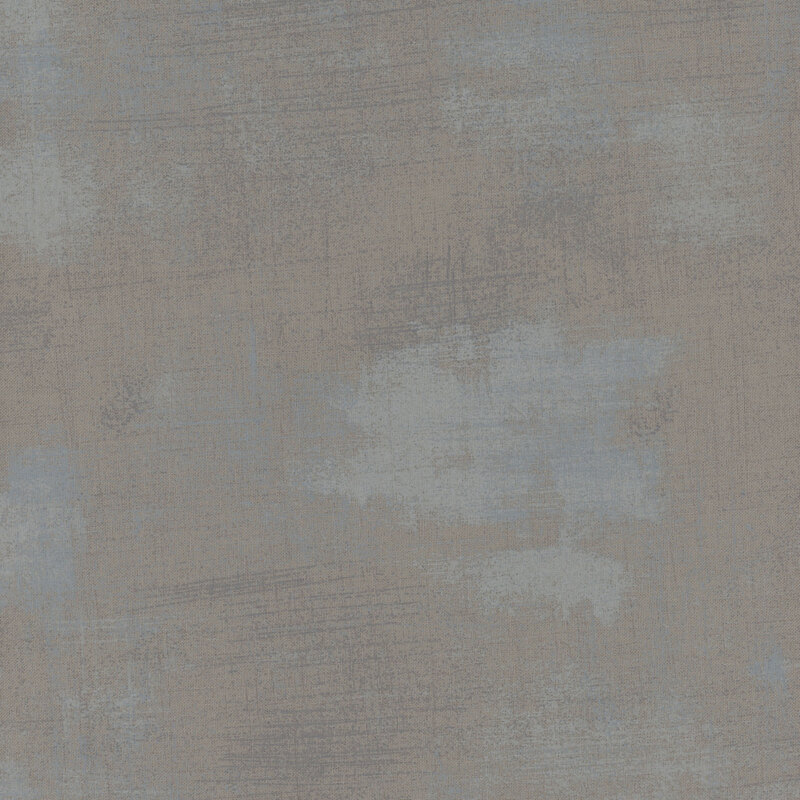 A textured fabric in shades of gray with hints of blue and subtle variations in tone.