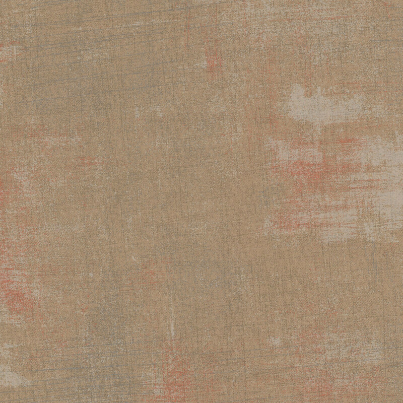 Textured beige fabric with subtle orange and blue undertones.