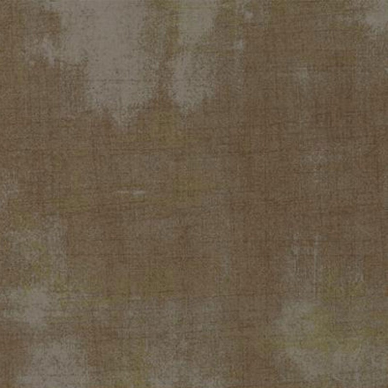 Fabric in neutral brown tones with subtle variations and hints of green.