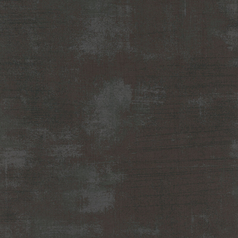 Abstract dark fabric with shades of black and subtle blue highlights.