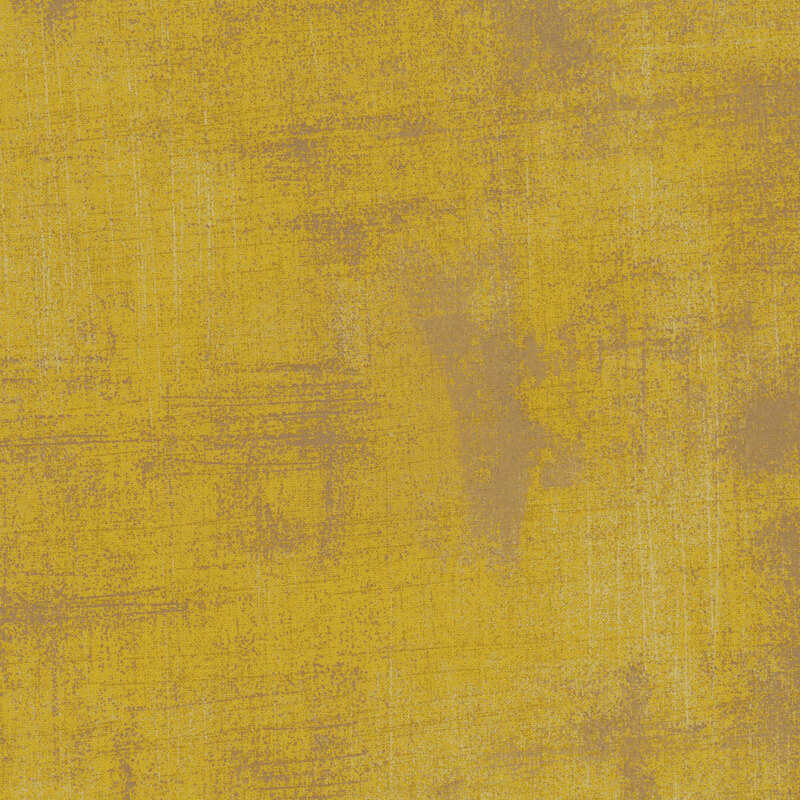 Textured fabric in muted shades of green with subtle variations and a soft, matte finish.