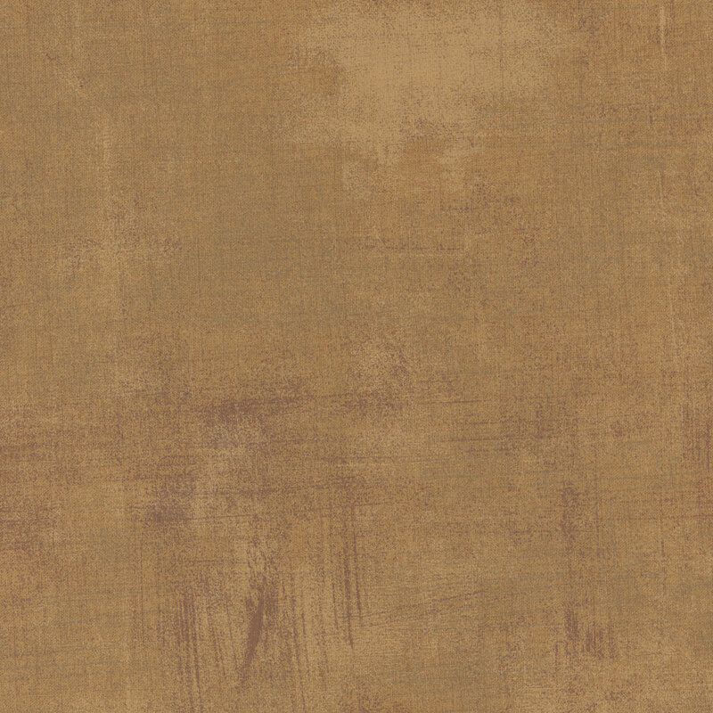 Textured fabric in warm beige with subtle variations and hints of gray.