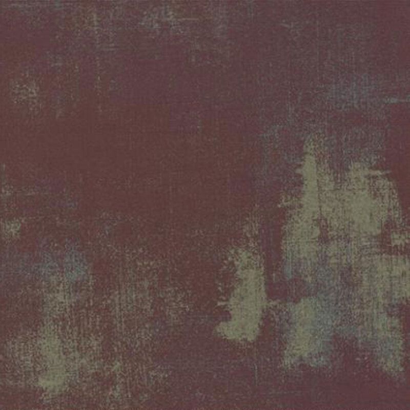 A textured fabric featuring dark maroon and subtle blue-green hues, resembling abstract brushstrokes.