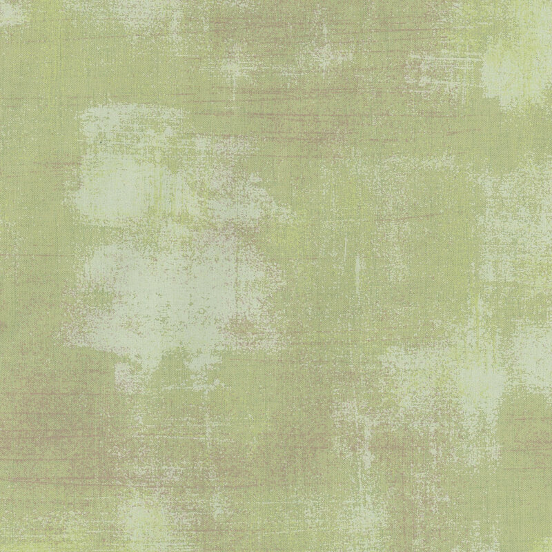 Textured light green fabric with subtle variations and a soft, painterly appearance.