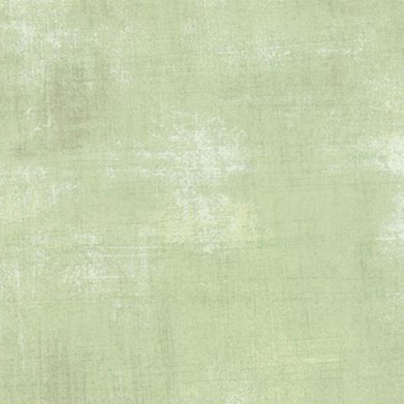 Textured light green background with subtle variations and a soft, painterly appearance.