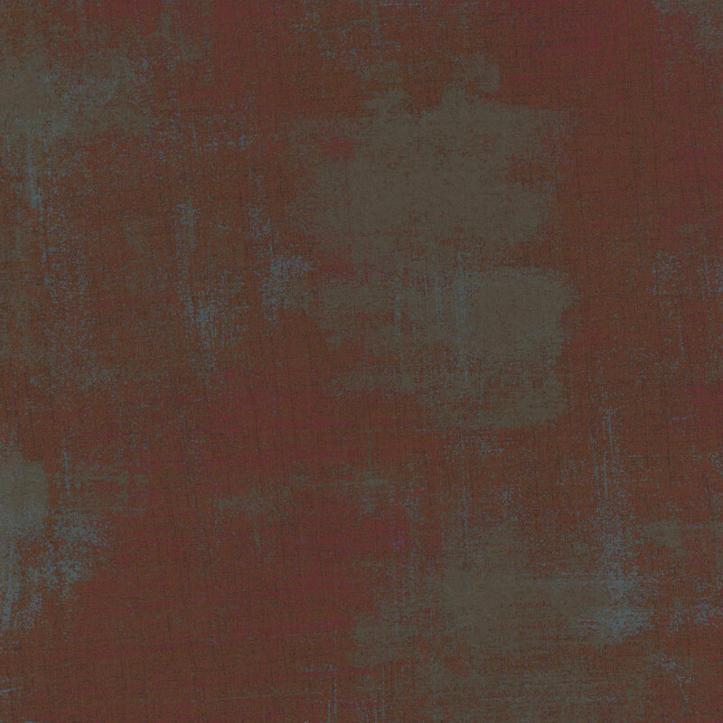 Abstract fabric in shades of dark red, blue, and green with a subtle grunge effect.