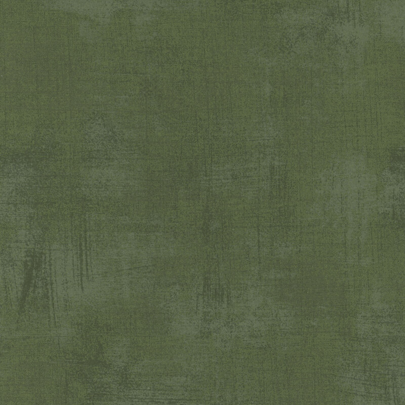 Solid green fabric texture with subtle variations in shade and a soft, matte finish.