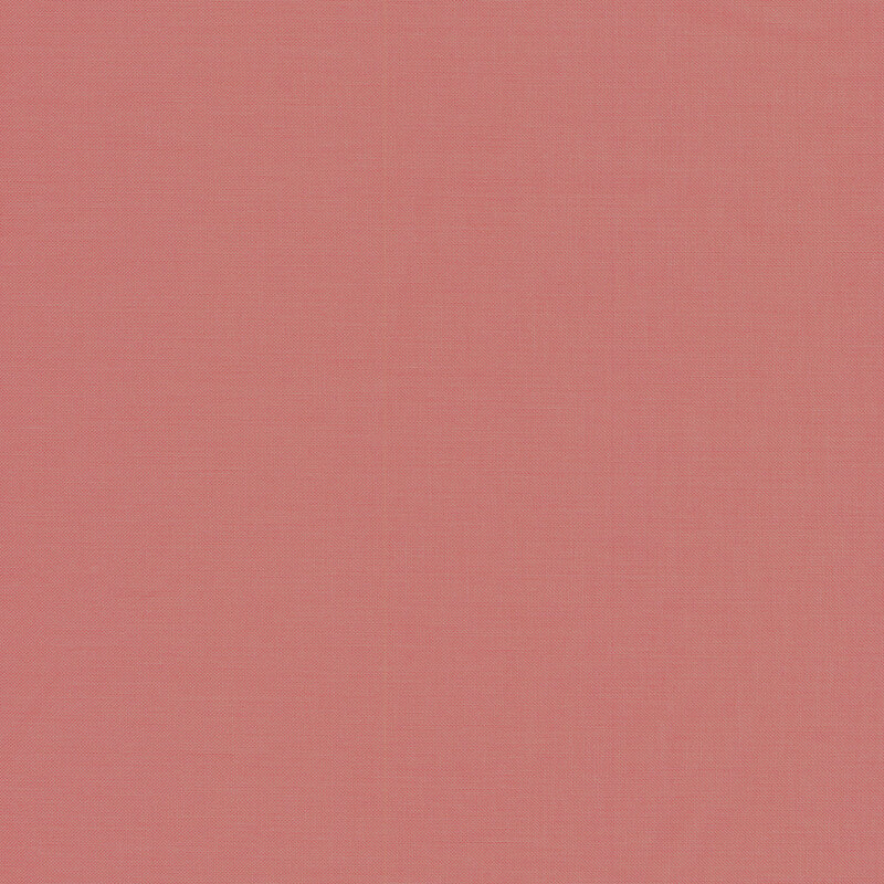 Solid dusty coral fabric swatch.