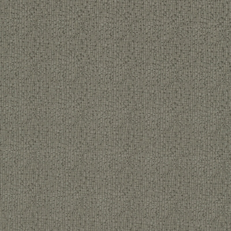 Textured gray fabric with a subtle woven pattern.