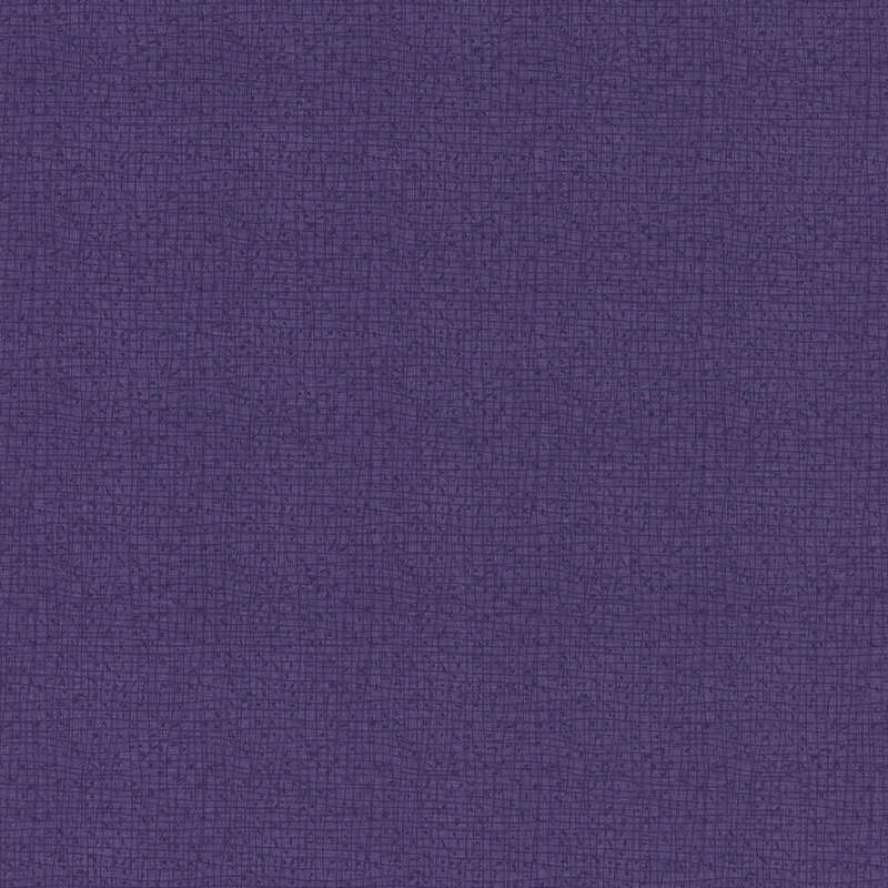 Textured blue-purple fabric with a subtle woven pattern.