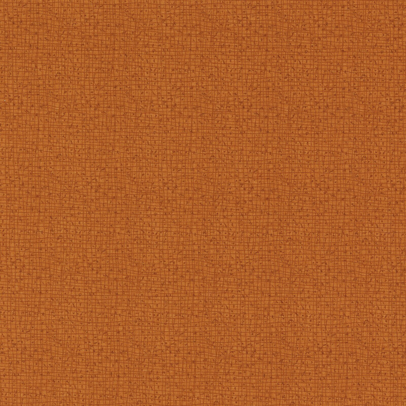 Textured brown fabric with a subtle woven pattern.