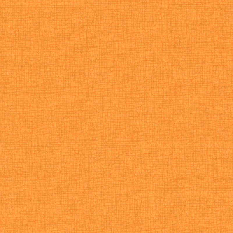 Close-up of a textured fabric in a light orange color