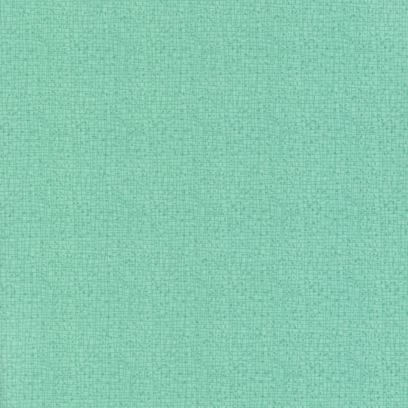 Textured aqua fabric with a subtle grid pattern.