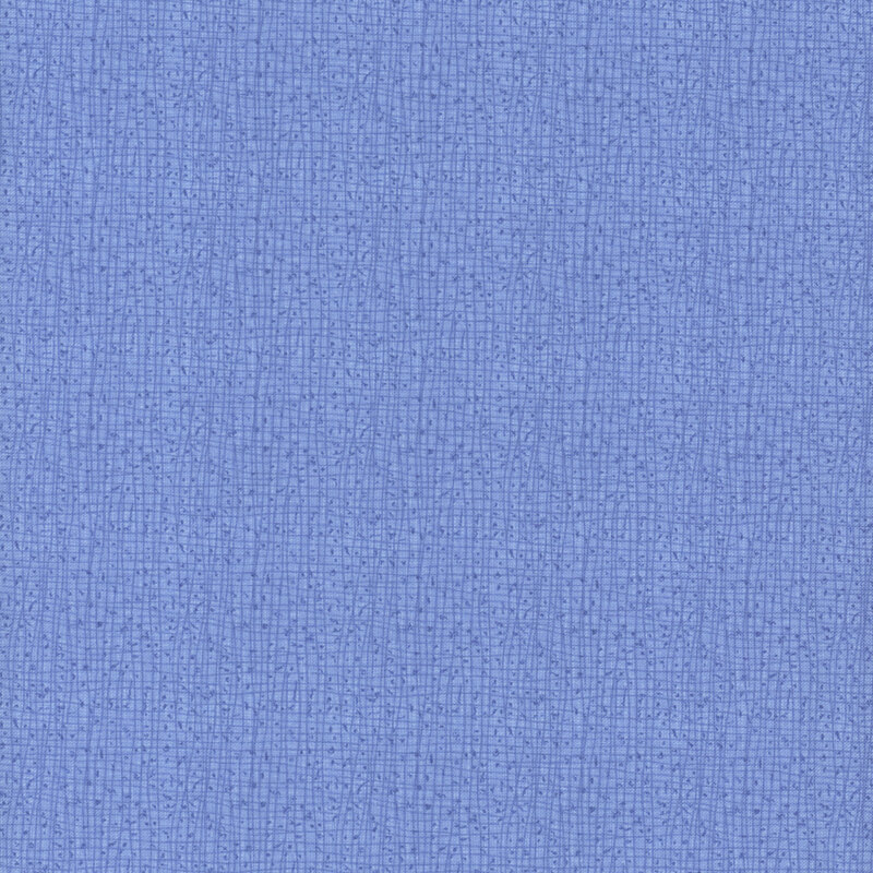 A textured blue fabric background with a woven pattern.