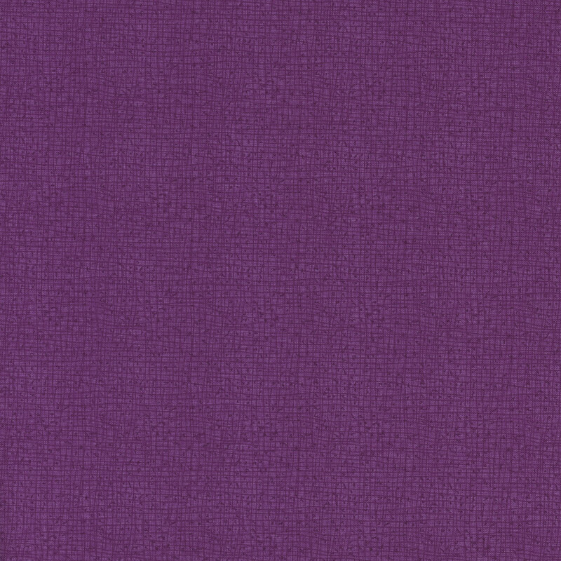 Textured purple fabric with a subtle woven pattern.