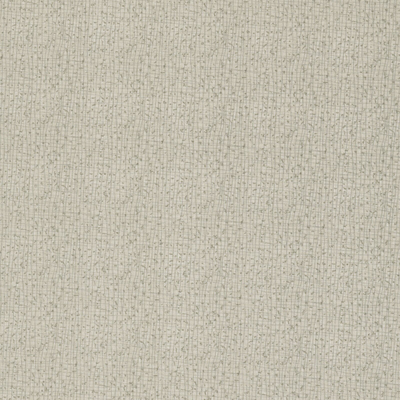 A close-up of a textured light gray fabric with small, subtle weaves.