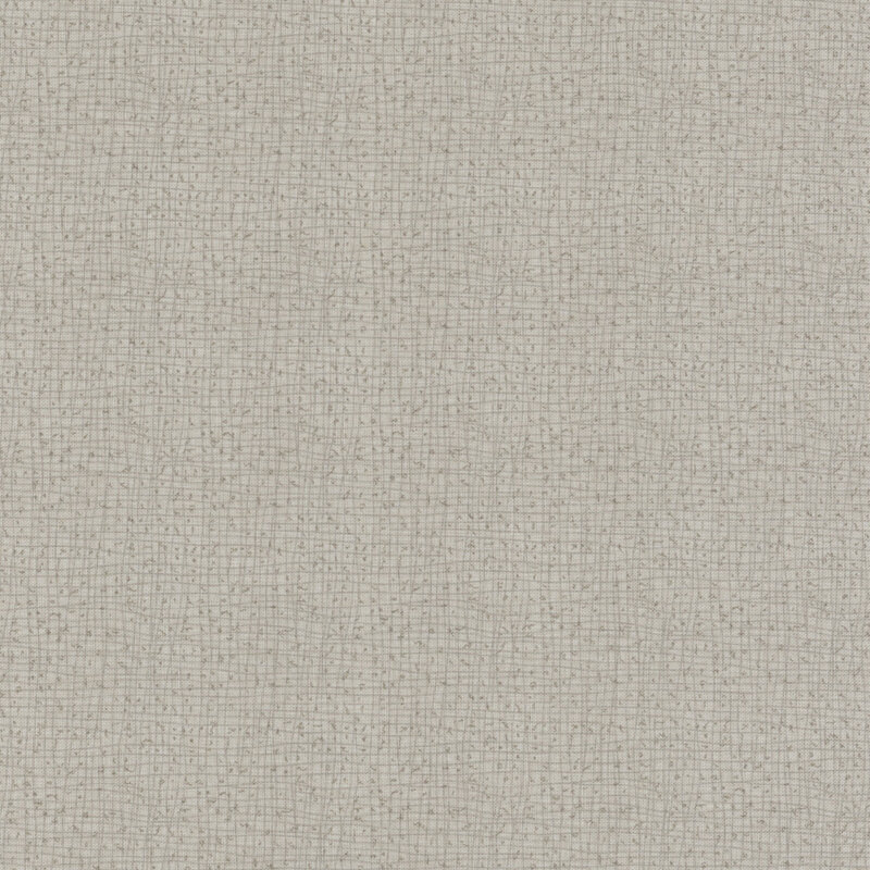 A close-up of a textured light gray fabric with small, subtle weaves.