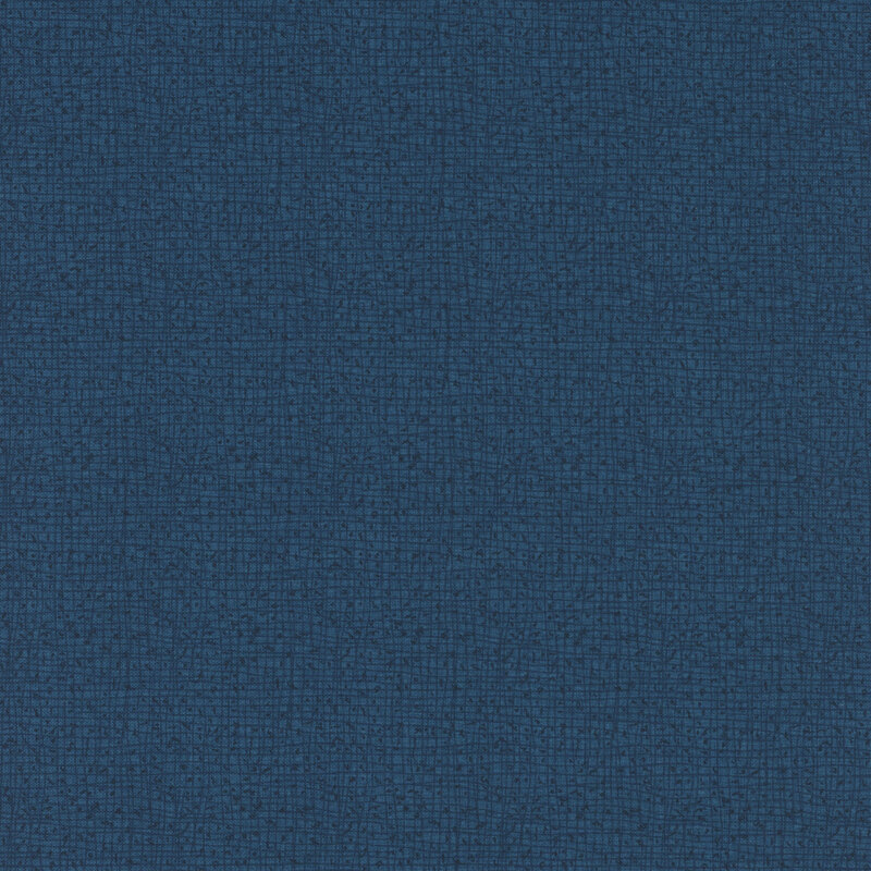 A textured fabric surface in a deep blue color with a subtle, interwoven pattern.