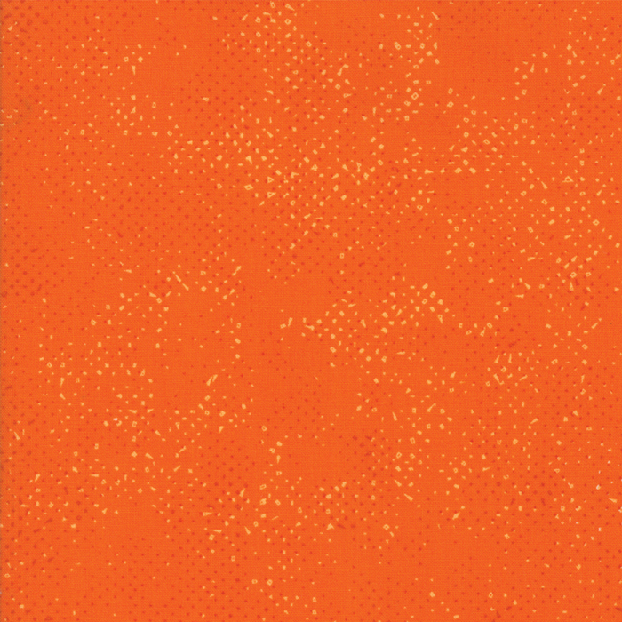 Textured bright orange fabric with a pattern of small tonal speckles