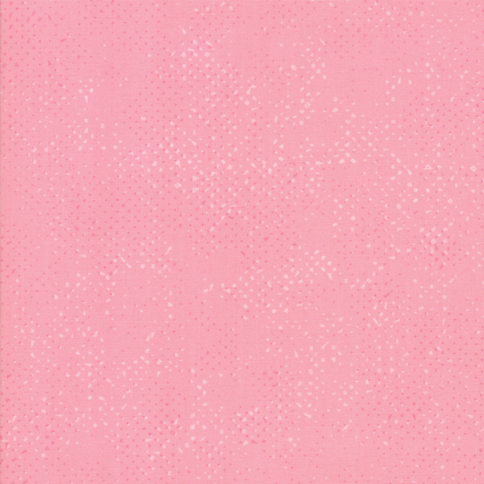 Textured light pink fabric with a pattern of small tonal speckles