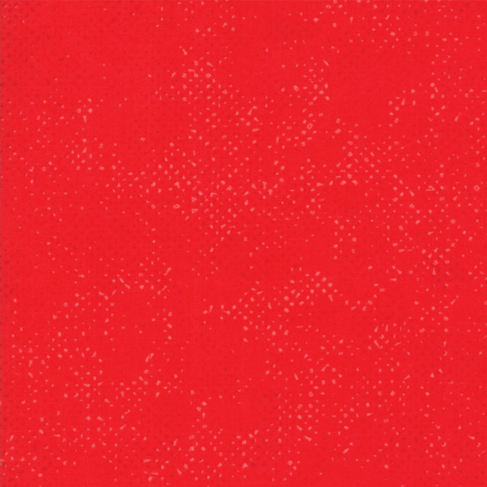 Textured bright red fabric with a pattern of small tonal speckles