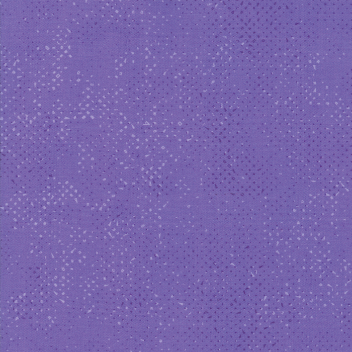 Textured purple fabric with a pattern of small tonal speckles