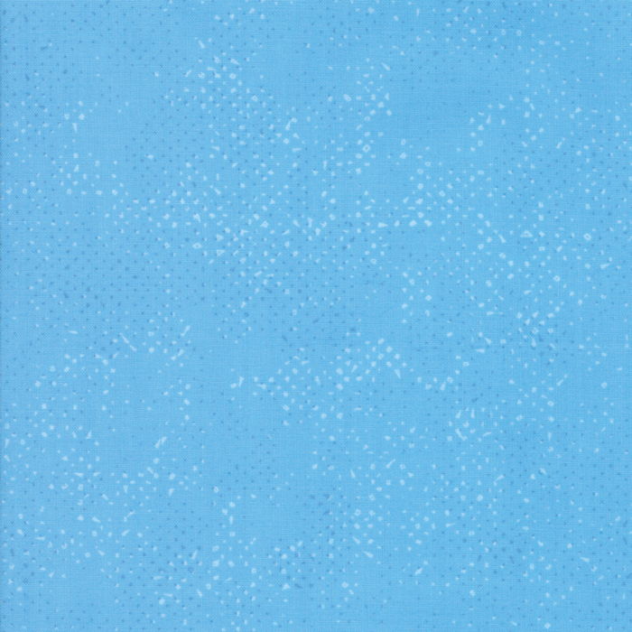 Textured sky blue fabric with a pattern of small tonal speckles