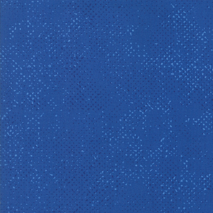 Textured cobalt blue fabric with a pattern of small tonal speckles