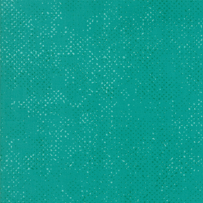 Textured turquoise fabric with a pattern of small tonal speckles