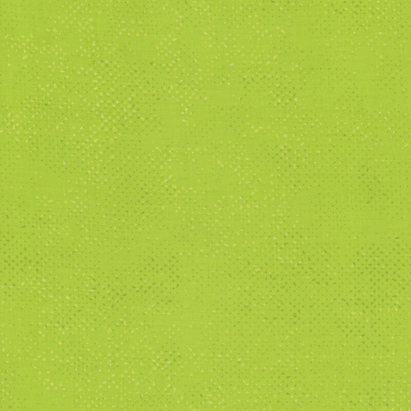 Textured lime green fabric with a pattern of small tonal speckles