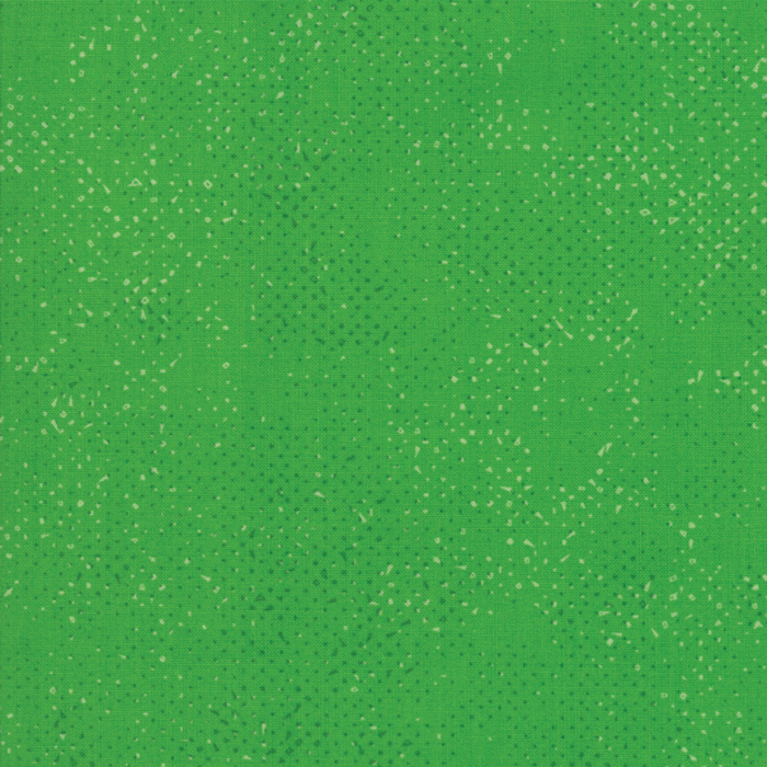 Textured green fabric with a pattern of small tonal speckles