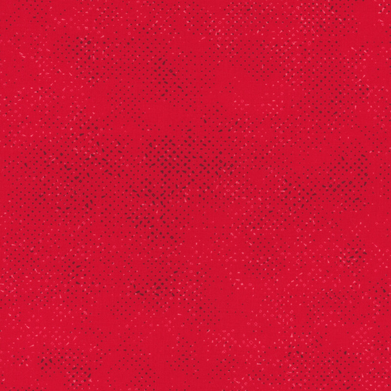 Textured bright red fabric with a pattern of small tonal speckles