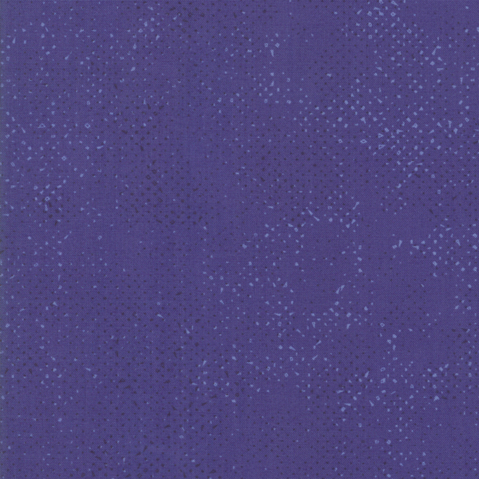 Textured lavender blue fabric with a pattern of small tonal speckles