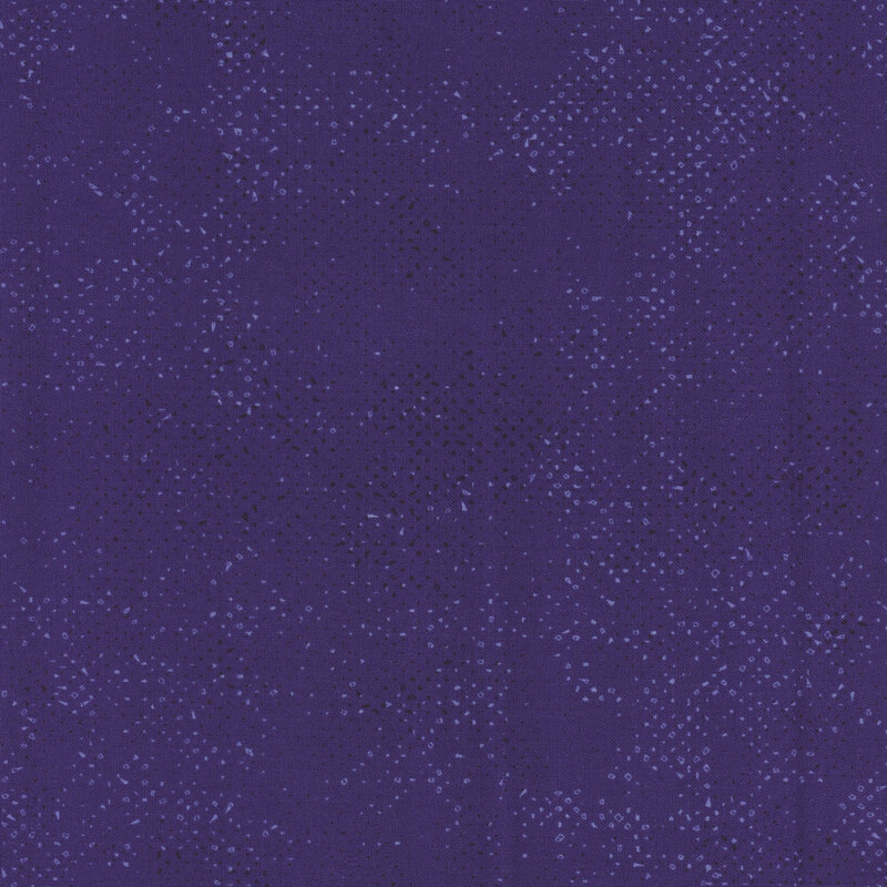 Textured indigo blue fabric with a pattern of small tonal speckles