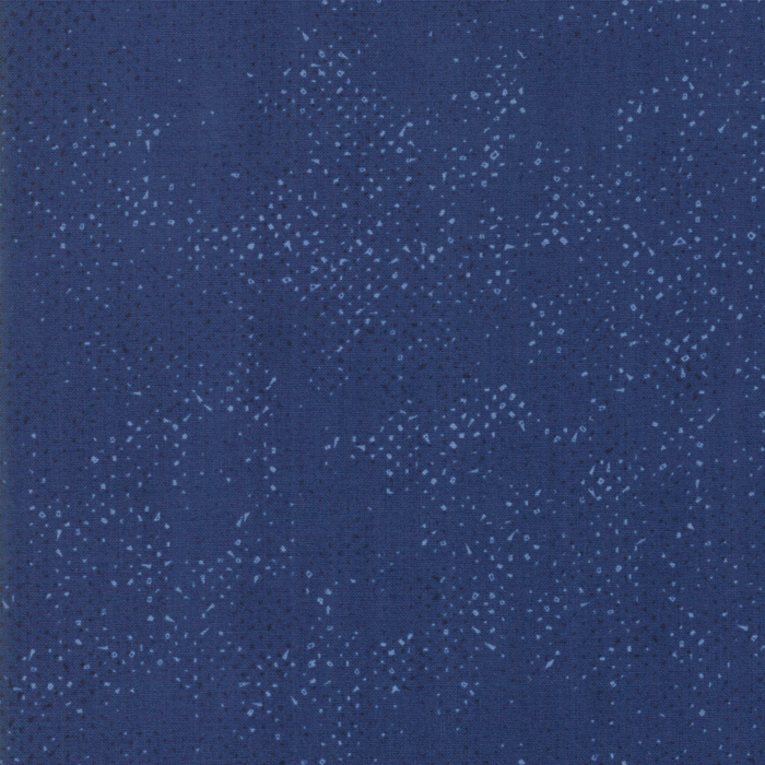 Textured navy blue fabric with a pattern of small tonal speckles