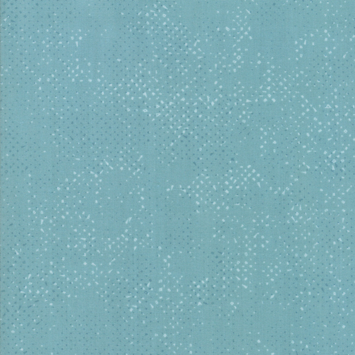 Textured light teal fabric with a pattern of small tonal speckles