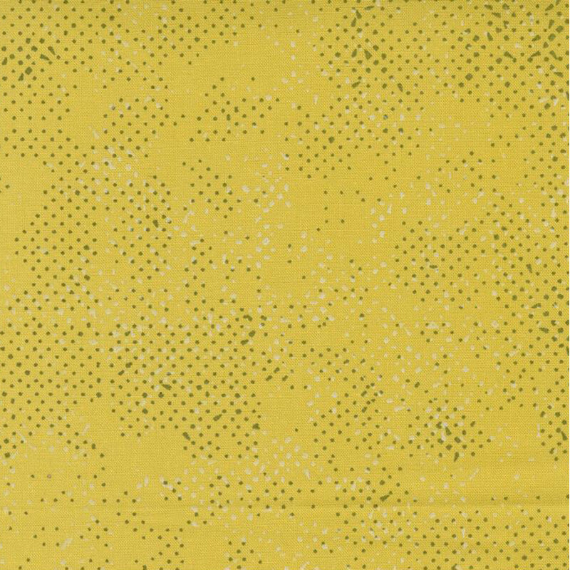 Textured yellow fabric with a pattern of small speckles