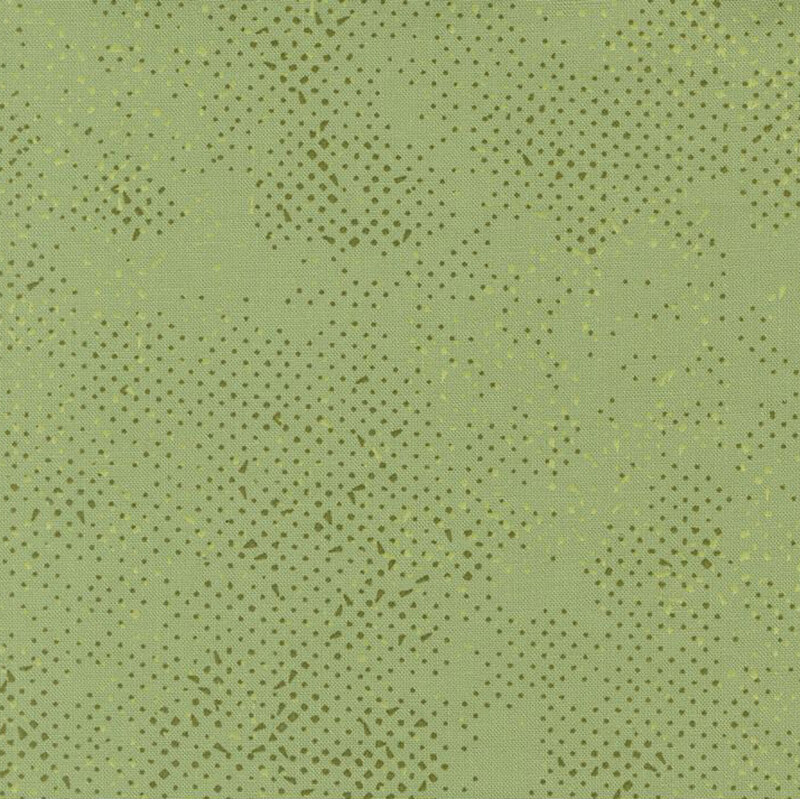 Textured sage green fabric with a pattern of small speckles