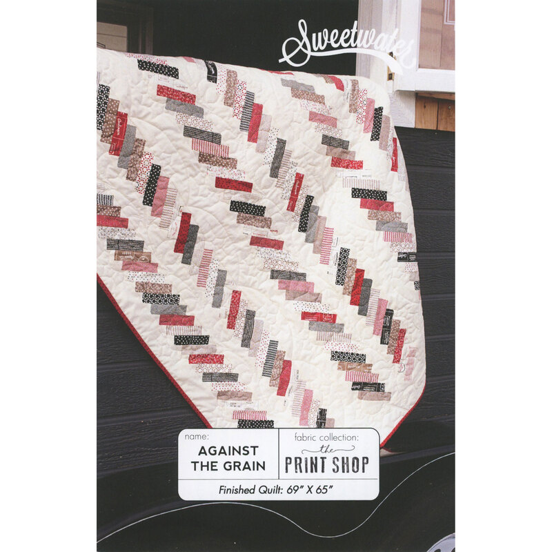 The front of the Against the Grain pattern, featuring a white quilt with a herringbone-esque multicolor geometric pattern.