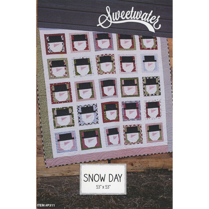 The front of the Snow Day pattern, featuring a white and multicolored quilt in Christmas fabrics with snowman head blocks.