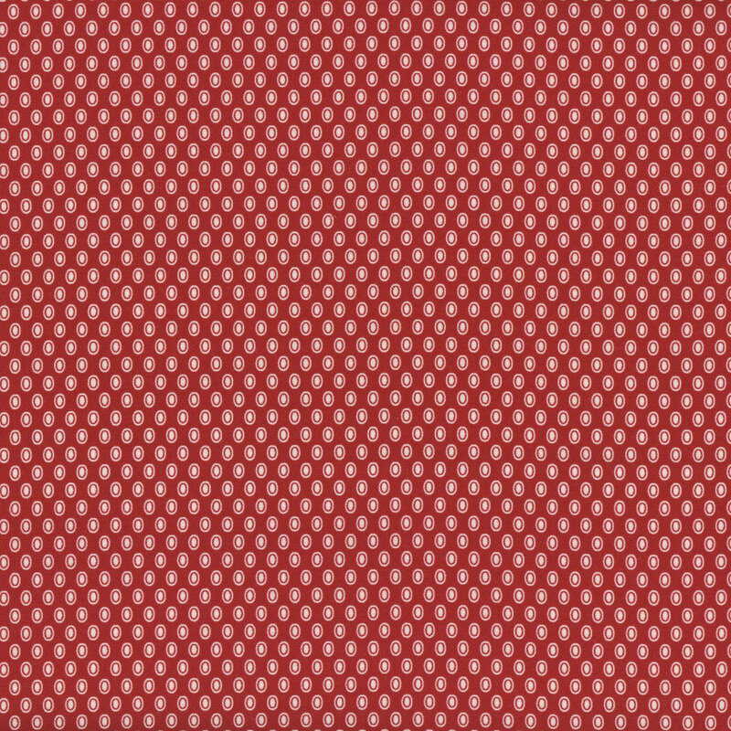 fabric pattern of white oval polka dots on a red background