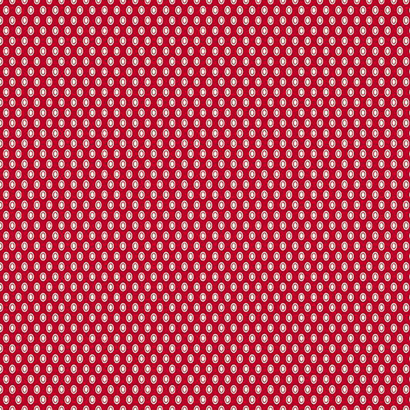 fabric pattern of white oval polka dots on a red background