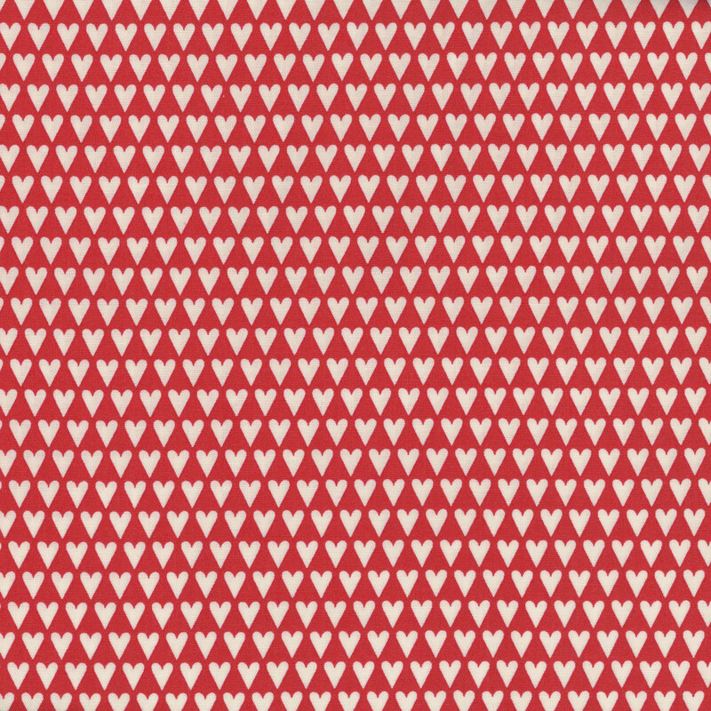 Red fabric with tight organized rows of hearts.