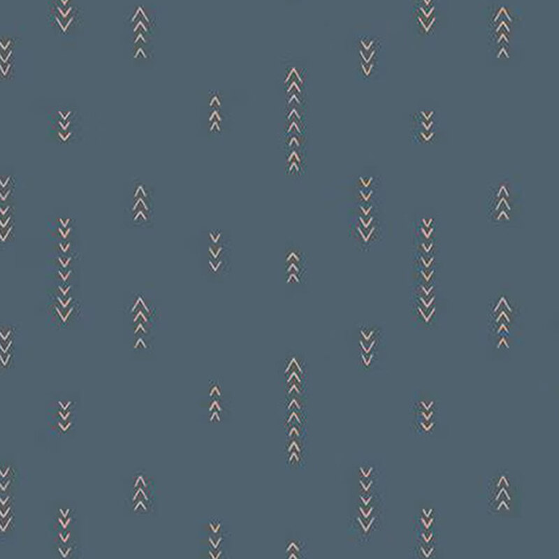 fabric pattern of orange arrow motifs on blue background