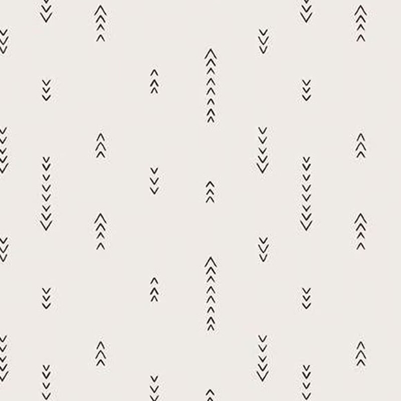 fabric pattern of black arrow motifs on white background