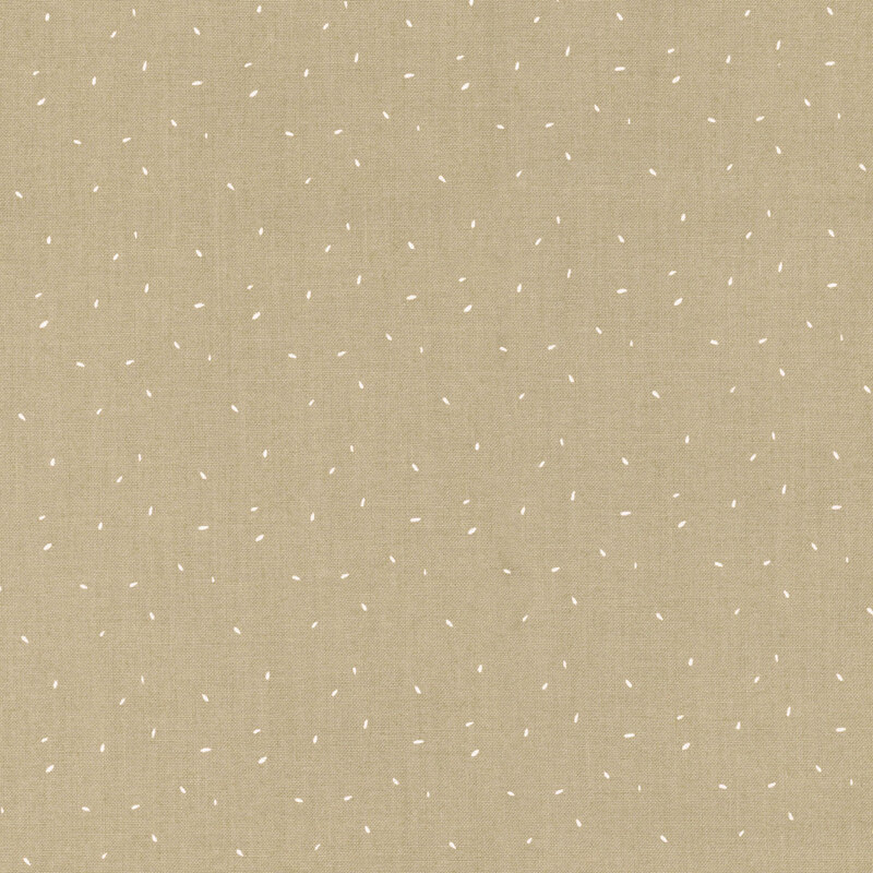 fabric with tiny white flecks on a warm tan background.