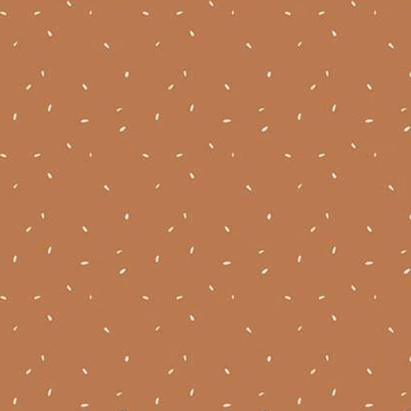 fabric pattern of white leaf motifs on a orange background