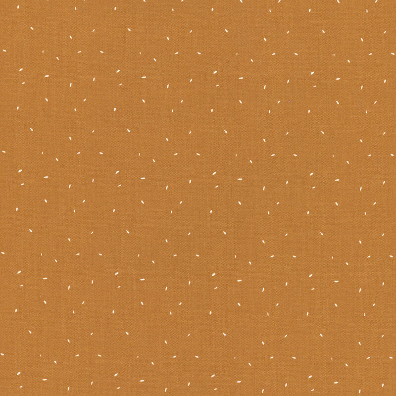 fabric with tiny white flecks on an orange background.
