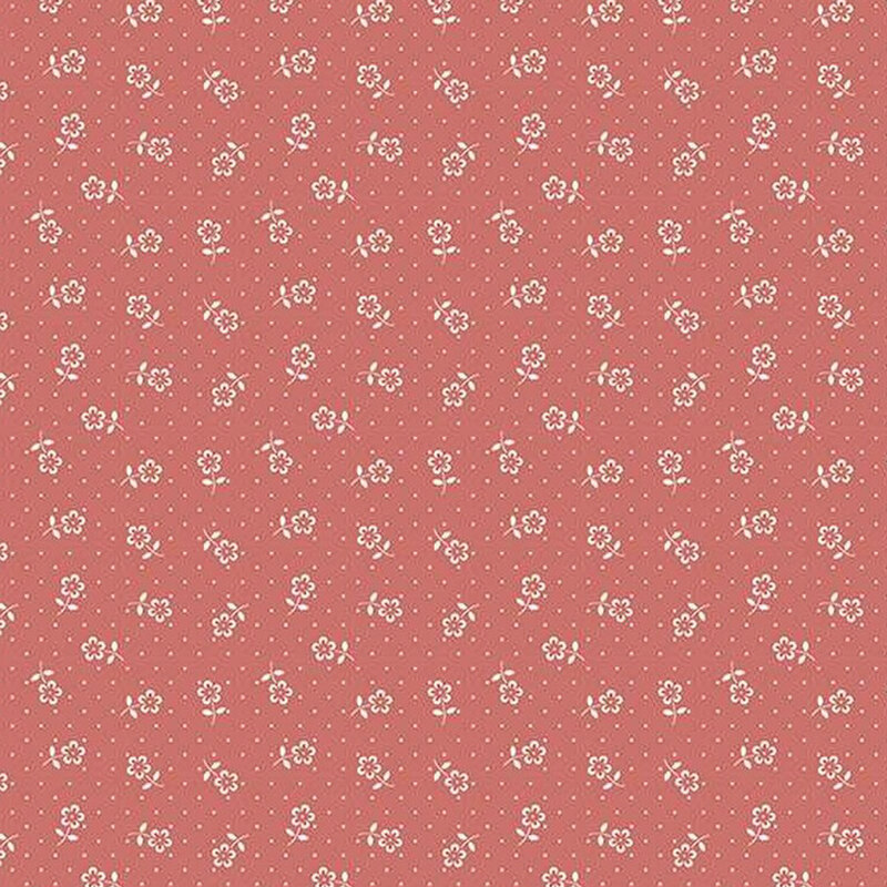 fabric pattern of white flower motifs over a brunt pink background